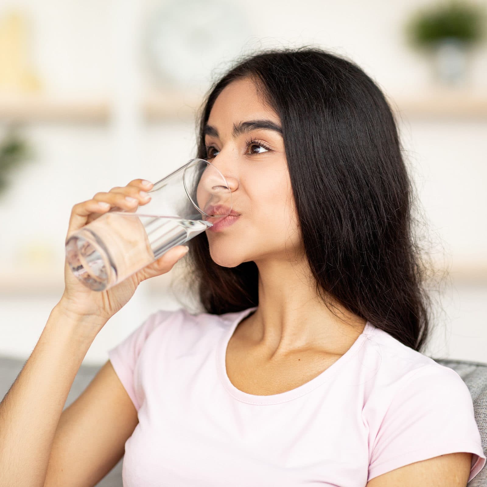 Woman drinking a glass of water