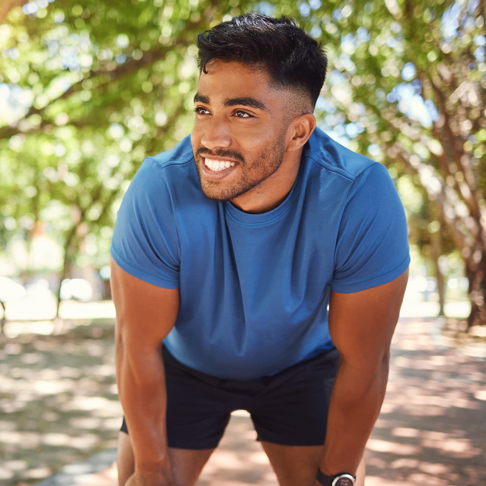 Man taking a break on run in the park