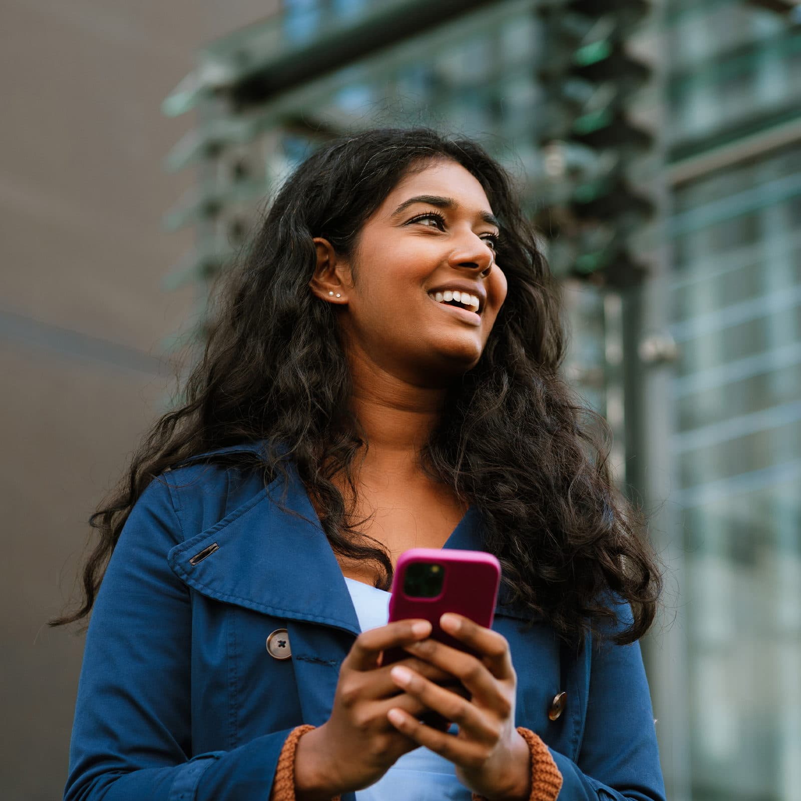 Woman on her phone smiling